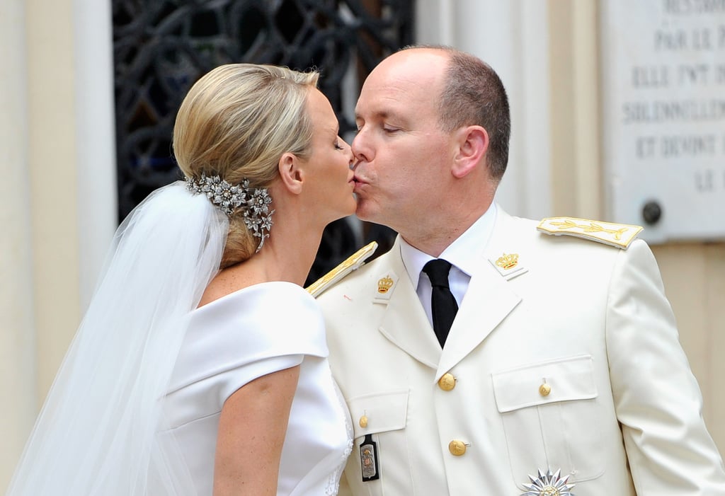 Charlene's wedding gown required months of handwork. On July 2, 2011, Charlene wore a silk Giorgio Armani gown for her religious ceremony. The dress was cut from 130 meters of silk, studded with 40,000 crystals and embellished with 20,000 mother-of-pearl teardrops.
  It was a star-studded event. Guests included Naomi Campbell, Karl Lagerfeld, Karolina Kurkova, French President Nicolas Sarkozy, Princess Victoria and Prince Daniel of Sweden, and Prince Mary and Prince Frederik of Denmark.