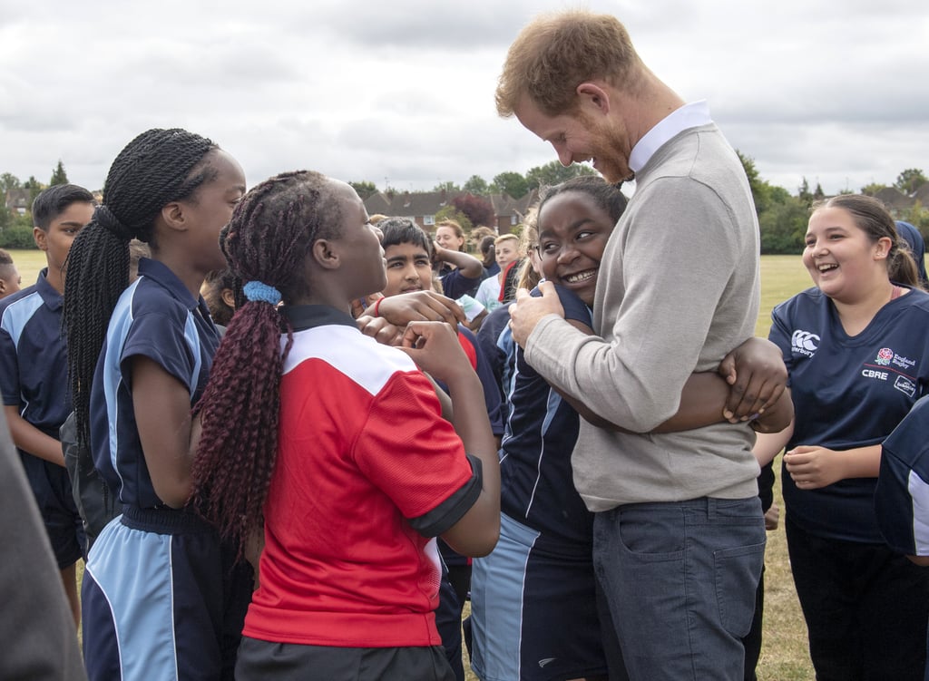 Prince Harry Hugs Kids at Lealands High School