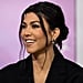 Kourtney Kardashian Cradles Her Baby Bump in a Red String Bikini