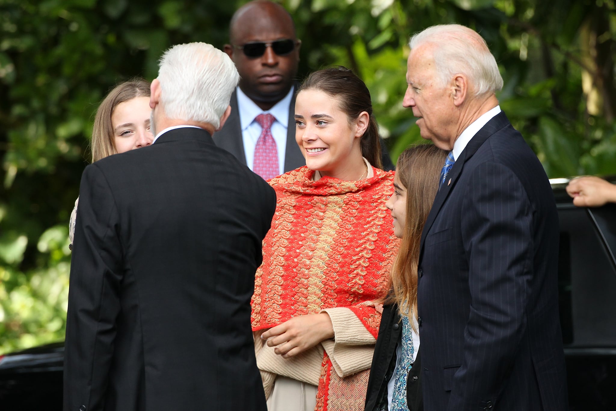 AUCKLAND, NEW ZEALAND - JULY 21:  US Vice-President Joe Biden (R) and his grand daughters including Naomi Biden (C) are welcomed at Government House on July 21, 2016 in Auckland, New Zealand. Biden is visiting New Zealand on a two day trip which includes meetings community and business leaders, a visit to Government House and a wreath laying ceremony at the Auckland War Memorial Museum.  (Photo by Fiona Goodall/Getty Images)