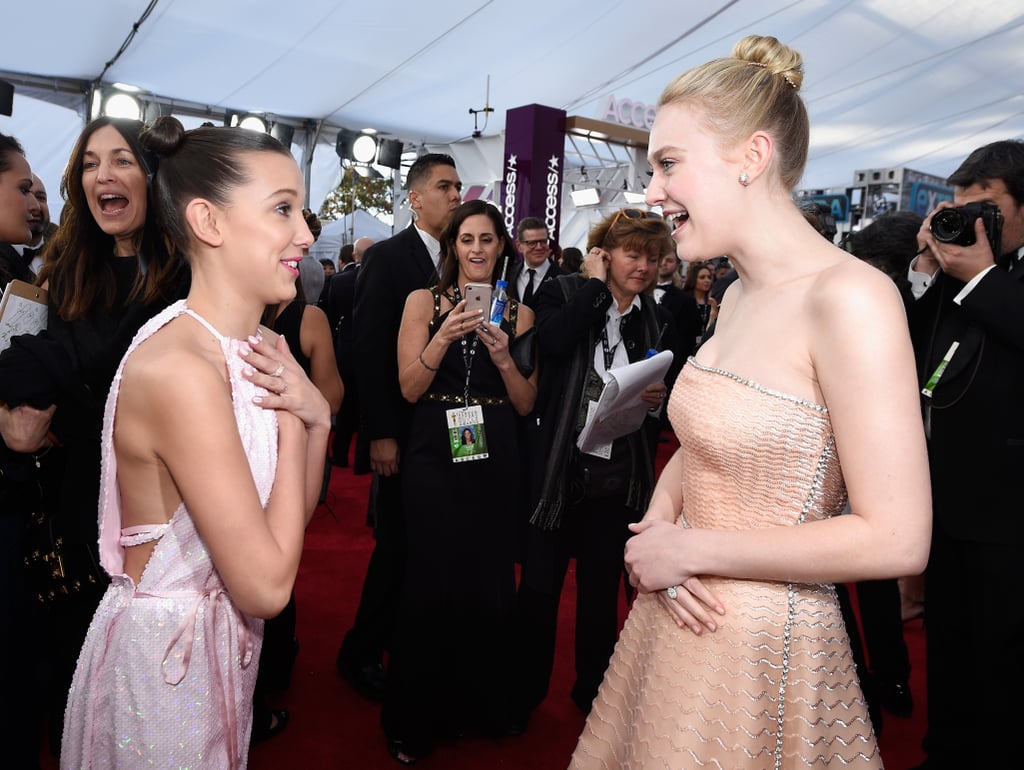 Pictured: Millie Bobby Brown and Dakota Fanning