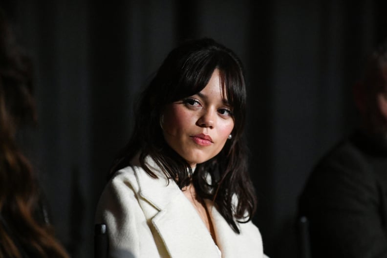 A close-up of Jenna Ortega's face as she speaks onstage.