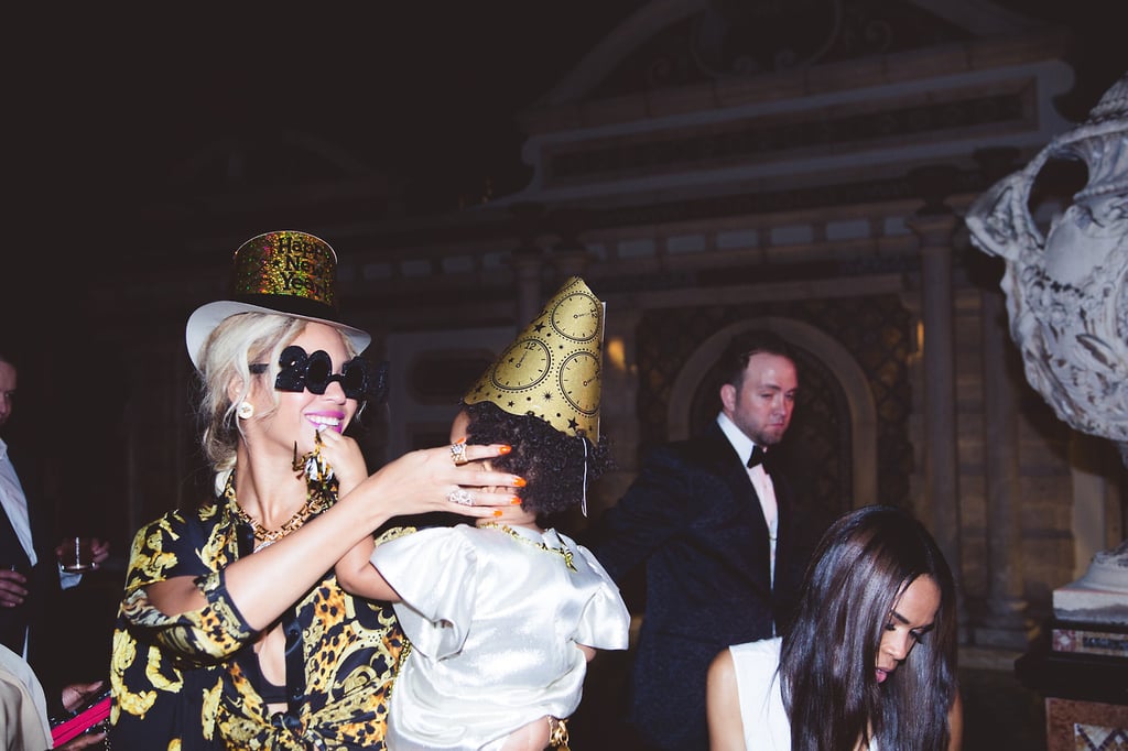 Beyoncé held on to Blue Ivy as they wore festive party hats.
Source: Tumblr user Beyoncé Knowles
