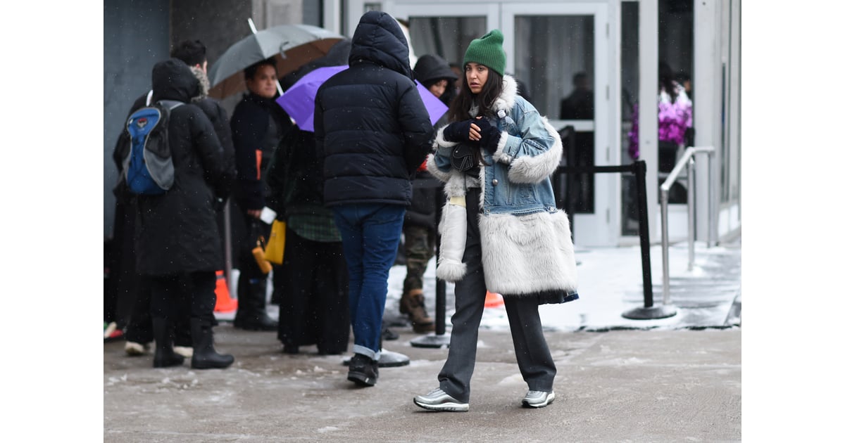 Winter Outfit Idea A Big Fur Trimmed Coat And Cool Sneakers 100 Street Style Shots To Inspire Your Winter Look Because You Deserve Better Than A Sweater And Jeans Popsugar Fashion