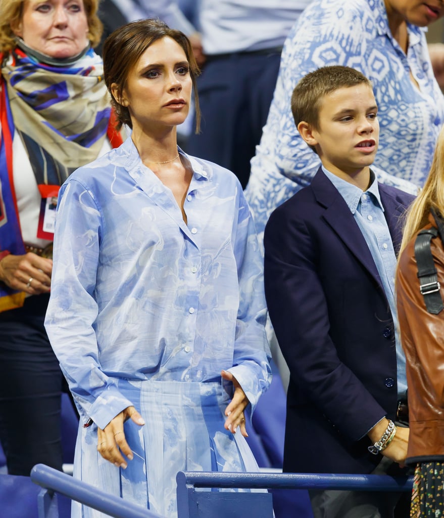 Victoria Beckham Wearing Blue Top and Skirt
