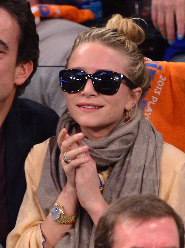 Mary-Kate Olsen contrasted a light top and scarf with her dark, structured shades at a New York Knicks game in 2013.