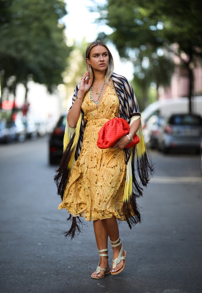 This red Bottega clutch is the star of this breezy look.