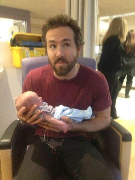 Ryan Reynolds Holding a Baby