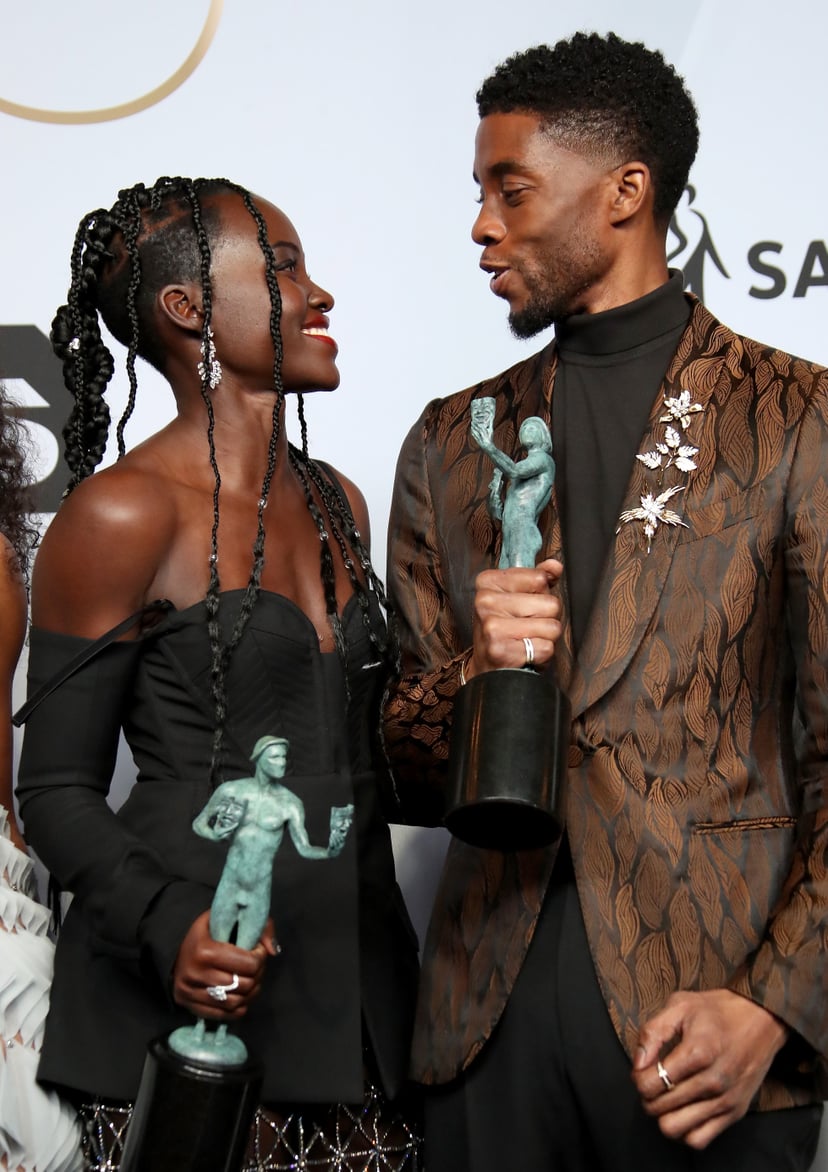 LOS ANGELES, CA - JANUARY 27: Lupita Nyong'o and Chadwick Boseman, winners of Outstanding Performance by a Cast in a Motion Picture for 'Black Panther,' pose in the press room during the 25th Annual Screen Actors Guild Awards at The Shrine Auditorium on J