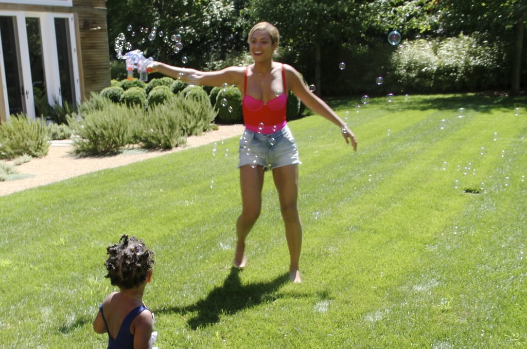 She knows there's nothing more fun than bubbles in the backyard.