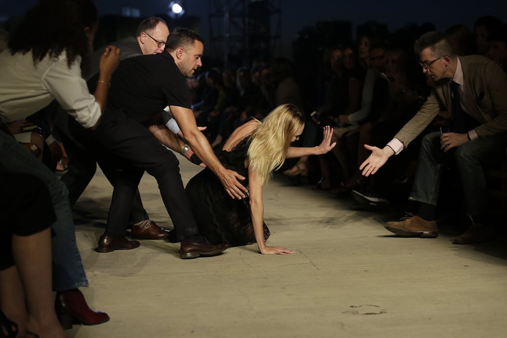 A group of gentlemen in the front row rushed to help Candice to her feet.