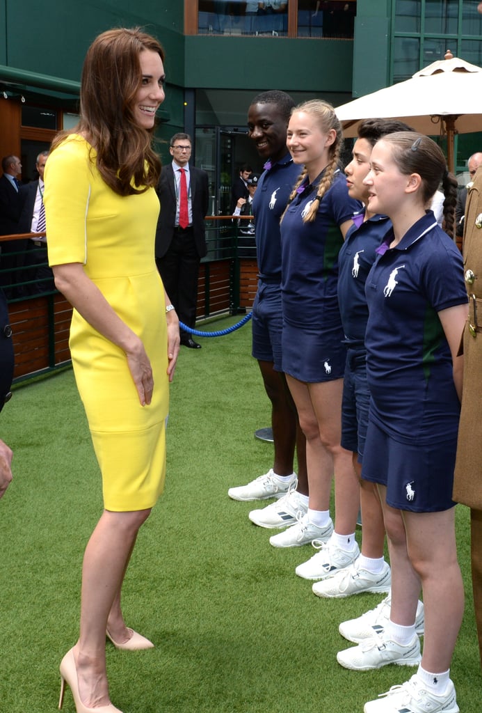 Kate held the attention of a group of ball boys and girls at Wimbledon in July 2016.