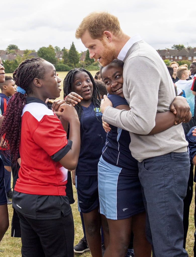 Prince Harry Hugs Kids at Lealands High School