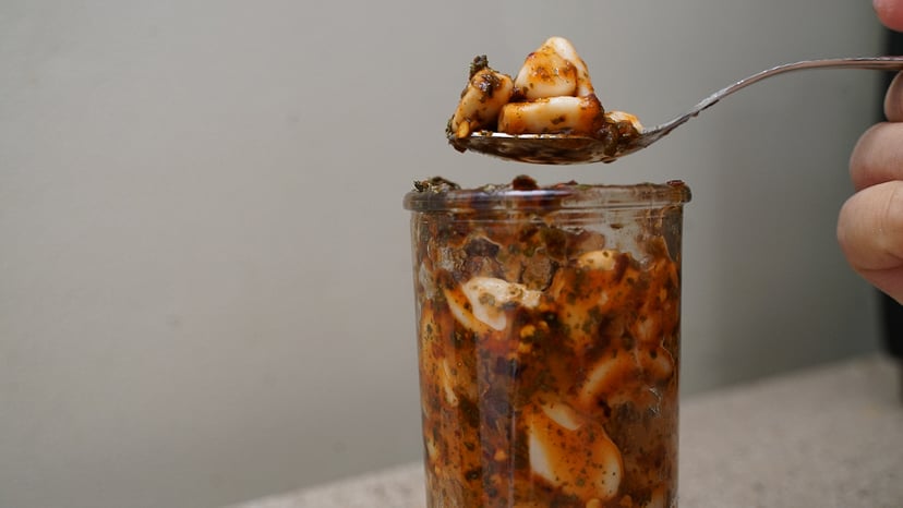 tiktok's spicy pickled garlic on a spoon