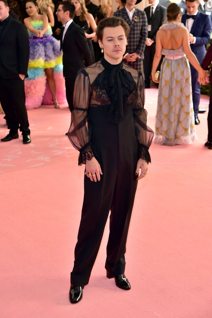 Wearing heeled mules with a sheer Gucci blouse and high-waisted trousers to the 2019 Met Gala.
