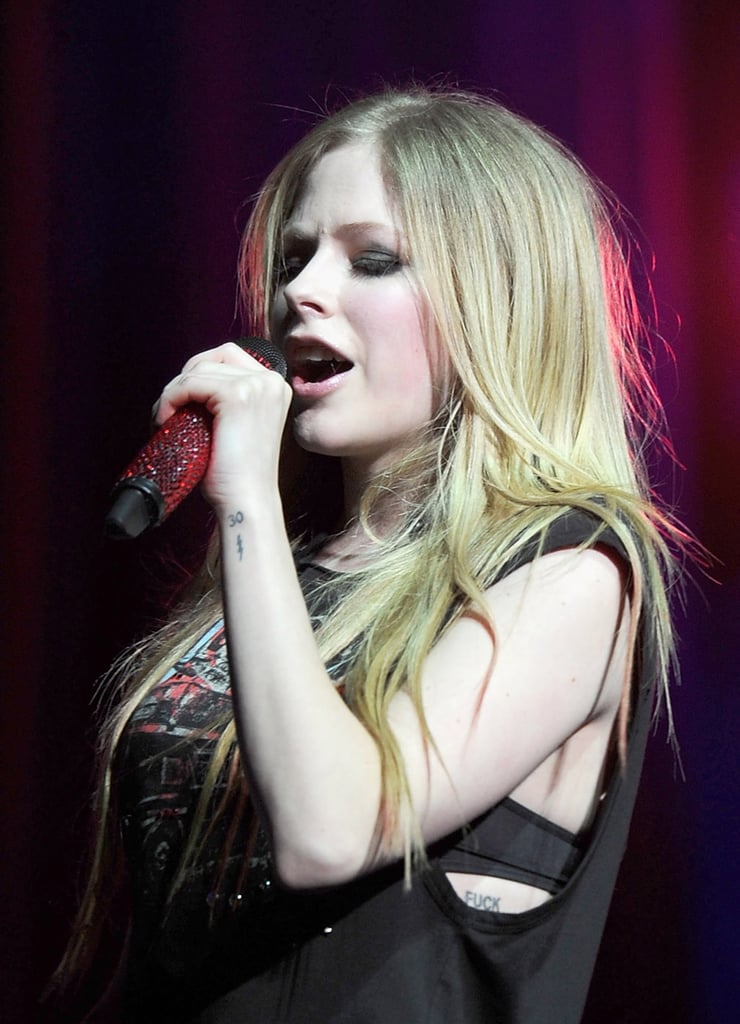 Avril Lavigne’s “FUCK” Ribcage Tattoo