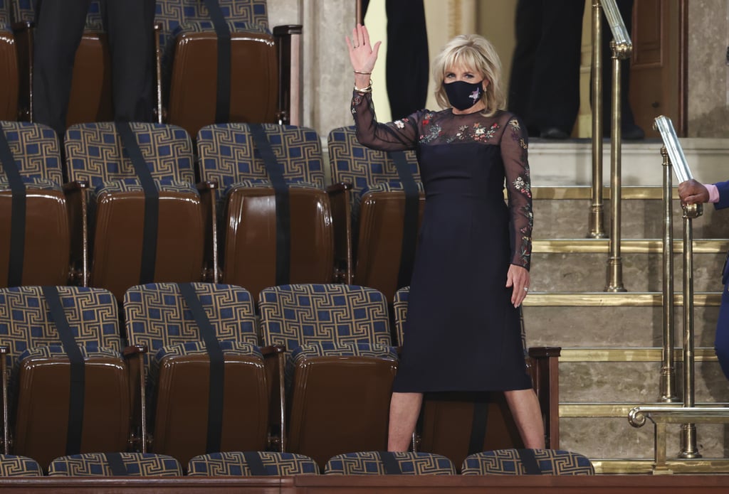 Biden wearing a navy version of her Inauguration evening dress — this one used during fittings and repurposed for "another occasion," which ended up being President Joe Biden's first address to Congress, marking his first 100 days in office.