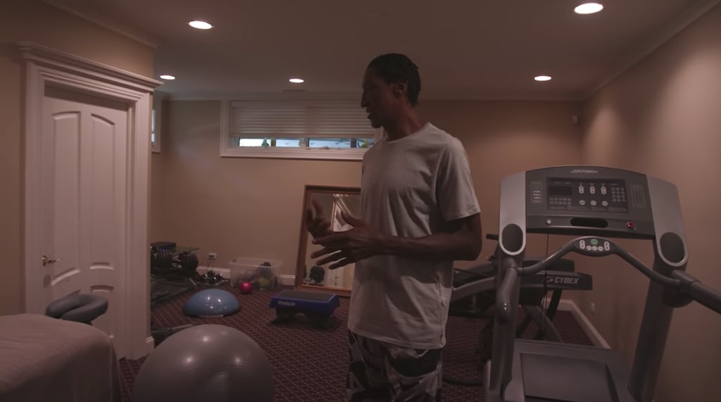 Next, he shows us the workout room, which includes a massage table.