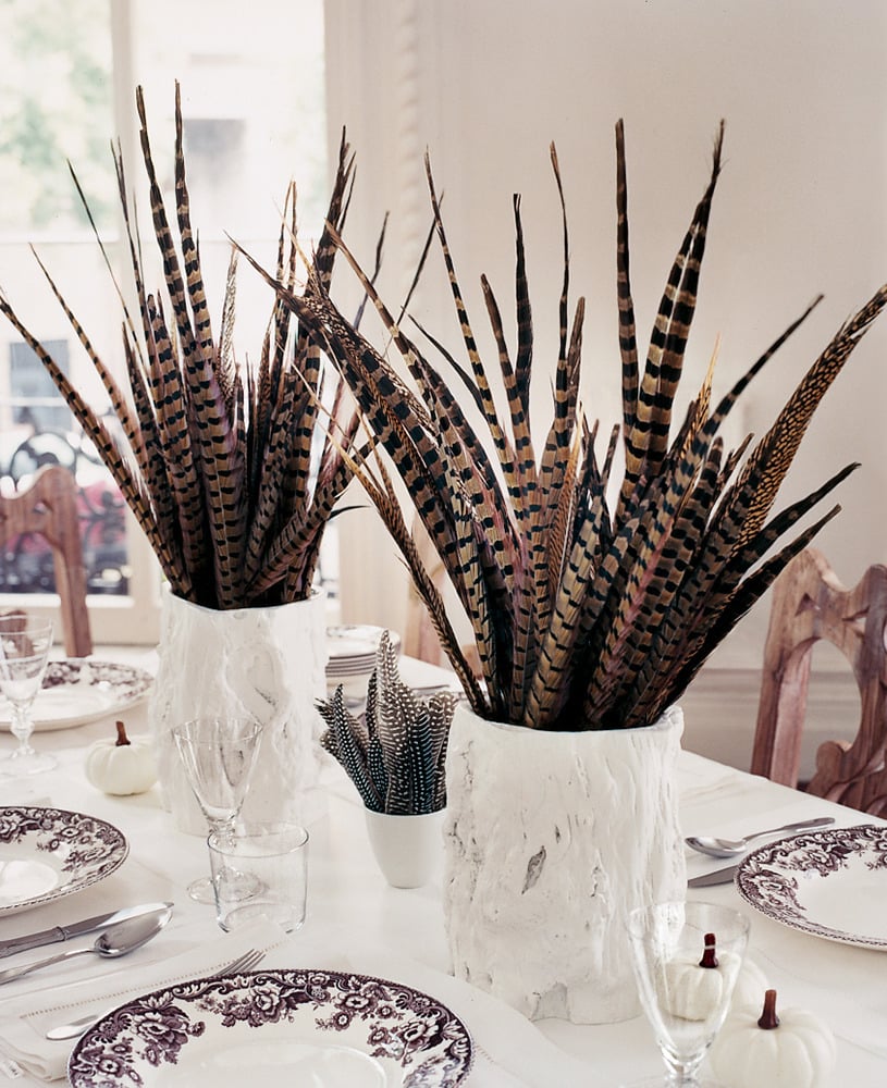 For a stark and dramatic look, contrast dark pheasant feathers with a clean, white tablescape.