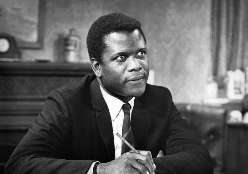 Sidney Poitier sitting with pencil while looking up in a scene from the film 'To Sir, With Love', 1967. (Photo by Columbia Pictures/Getty Images)