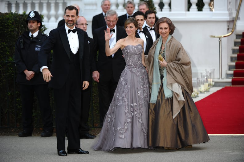 Wearing a Dove Gray Strapless Gown With Floral Details From Felipe Varela