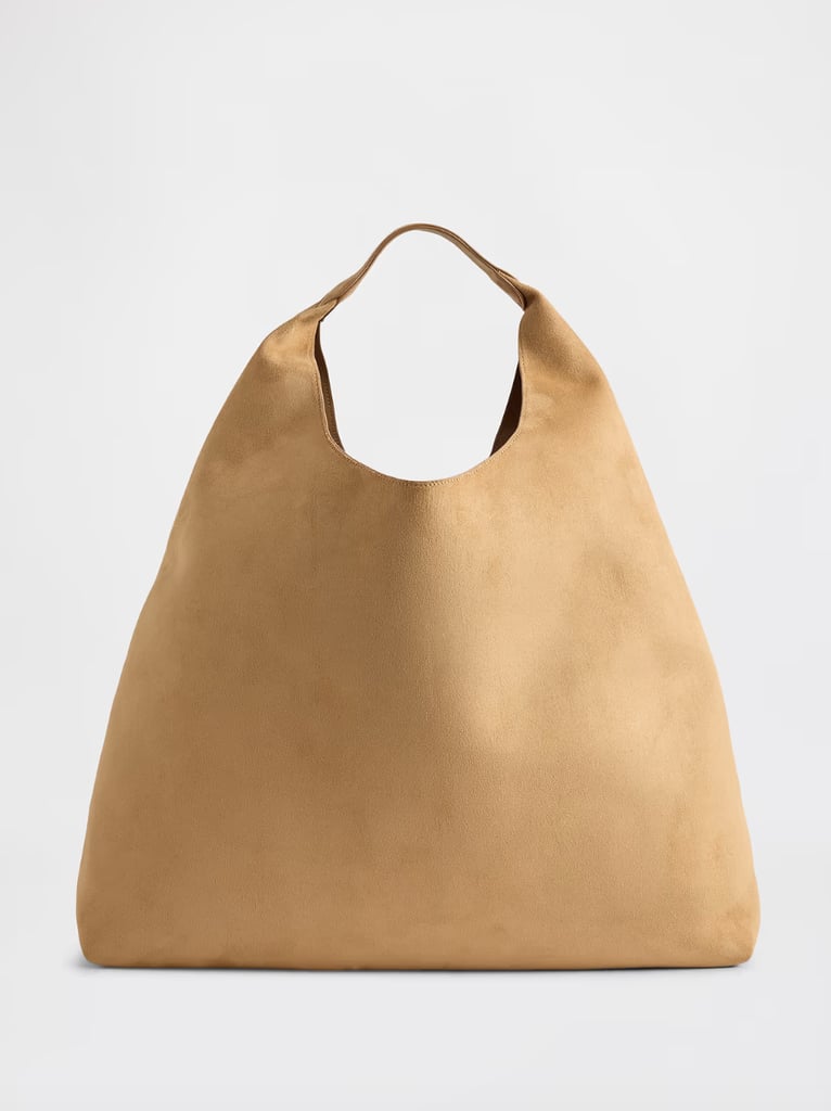 Gap Factory Slouchy Vegan-Suede Tote Bag ($20, originally $50)
Fall is often the busiest time of year, which means I am constantly schlepping stuff from meetings to workouts to dinners. This extra large tote bag can keep up with a busy schedule and store all the essentials, from an extra outfit to a laptop. Plus, the tan suede fabric feels very fitting for the season.