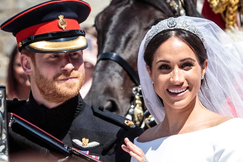 WINDSOR, ENGLAND - MAY 19: Prince Harry, Duke of Sussex and the Duchess of Sussex ride in the Ascot Landau carriage during the procession after getting married at St George's Chapel, Windsor Castle on May 19, 2018 in Windsor, England. Prince Henry Charles