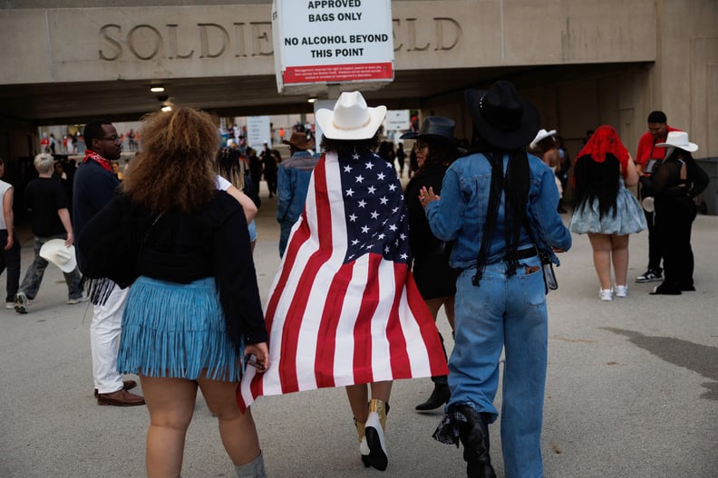 Elisabeth Johnson, 14, of Cincinnati, wears an American flag outside Soldier Field before attending the first night of Beyoncé's Cowboy Carter Tour performance Thursday May 15, 2025, in Chicago. (Armando L. Sanchez/Chicago Tribune/Tribune News Service via
