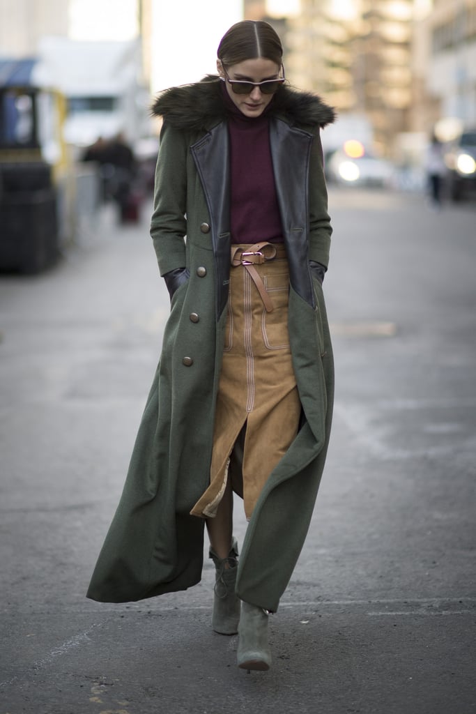 There's a reason Olivia is considered the queen of street style. During NYFW, Olivia stepped out in a trendy suede skirt, which she paired with a maroon turtleneck and floor-skimming military coat.