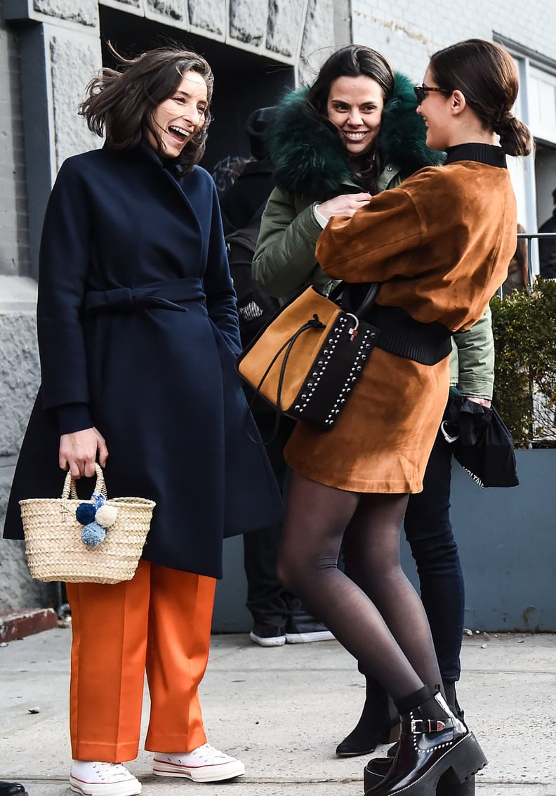 Style It With a Belted Trench Coat, Orange Trousers, and White Sneakers