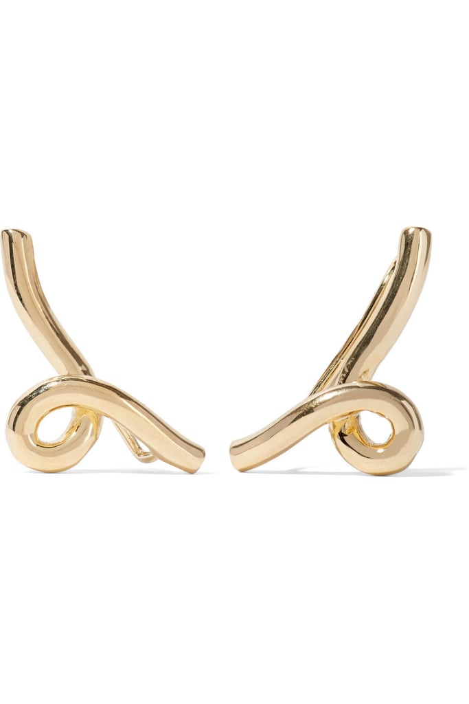I'm not a huge jewerly girl, but I'm sold on the subtle statement quality of Jennifer Fisher's gold-plated earrings ($215) — all the qualities of a piece you'll keep and wear for years.
— HWM