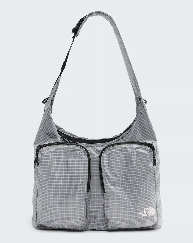 The North Face Never Stop Tote ($130)
Never underestimate the storage power of a good tote bag. Equipped with two front pockets and one large opening, you can trust that all your travel essentials will find a home and stay organized on the go. Durability is one of this design's strongest characteristics. Made out of recycled material and reflective webbing, this bag can take anything you throw at it from getting caught in the rain or being shoved under a tight seat. It might not be the typical carry-on but it has the potential to become your favorite travel companion. 
Pros: The bag can easily double as a daytime tote while on vacation.
Material: Nylon and polyester.
Dimensions: 11" height x 16.5" width x 9" depth
Colorways: 4
Who it's best for: Students.
Extras: It has a laptop pocket, water bottle sleeve, and a padded shoulder strap.