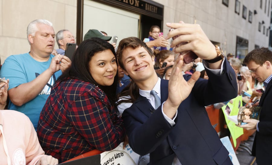 The Fault in Our Stars' Ansel Elgort snapped a selfie with a fan in NYC in June 2014.