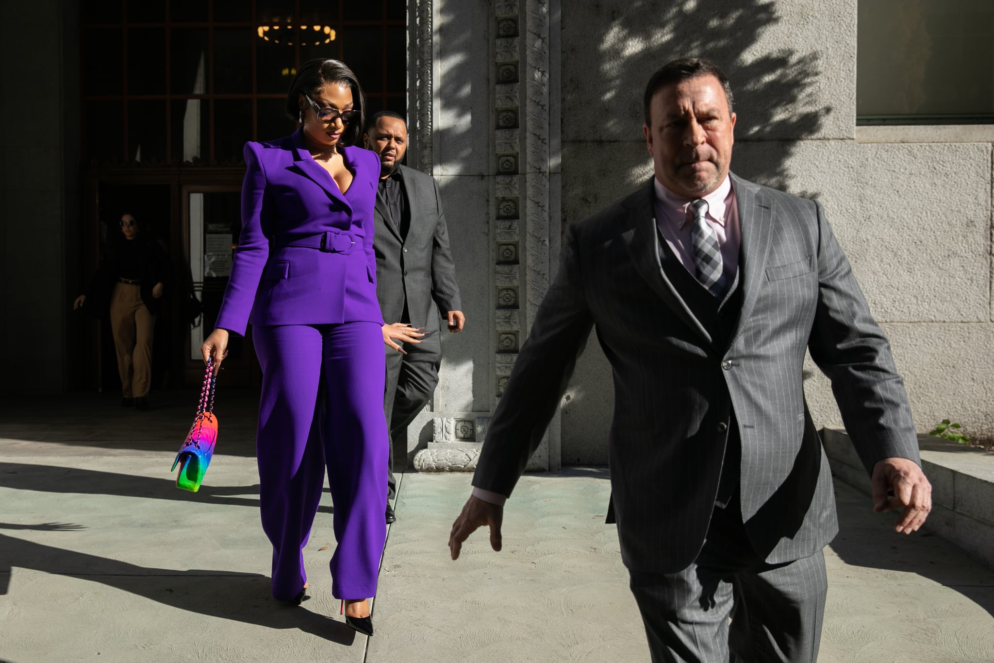 LOS ANGELES, CA - DECEMBER 13: Megan Thee Stallion whose legal name is Megan Pete makes her way from the Hall of Justice to the courthouse to testify in the trial of Rapper Tory Lanez for allegedly shooting her on Tuesday, Dec. 13, 2022 in Los Angeles, CA. (Jason Armond / Los Angeles Times via Getty Images)