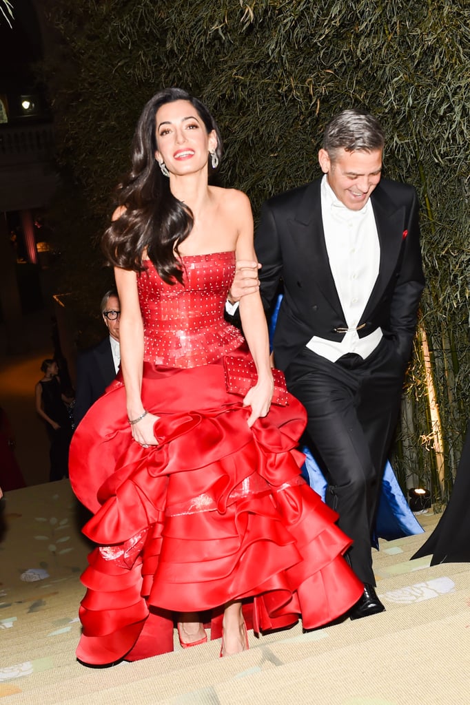 George and Amal Clooney were all smiles as they made their way into the exhibit.