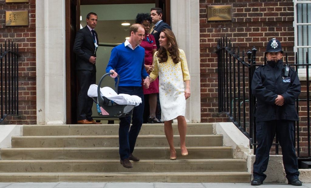 For her second postpartum hospital appearance, Kate again opted to wear Jenny Packham, this time a custom white and yellow floral dress. The look, paired with nude heels instead of wedges, was less casual than her first. The more formal appearance supports the idea that Kate was much more at ease and secure in her role, having been through the process before.  
Again her postpartum figure was discussed, but for women who'd experienced childbirth themselves, the biggest shock was the color she'd chosen. Given the realities of postpartum recovery (giant mesh undies, anyone?!) white was a bold choice, and yet another reminder that the royals aren't exactly "just like us."