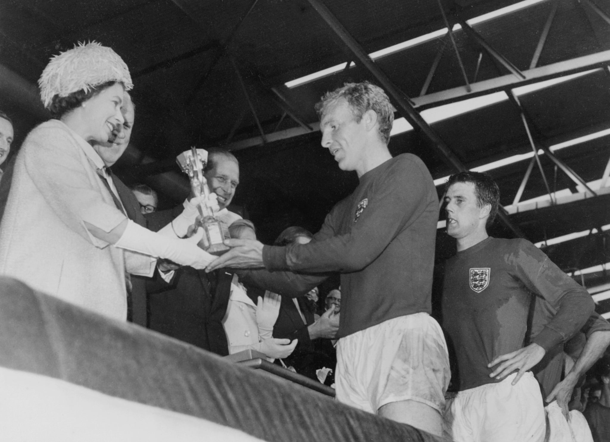 Queen Elizabeth II presents the Jules Rimet Cup to Bobby Moore in 1966