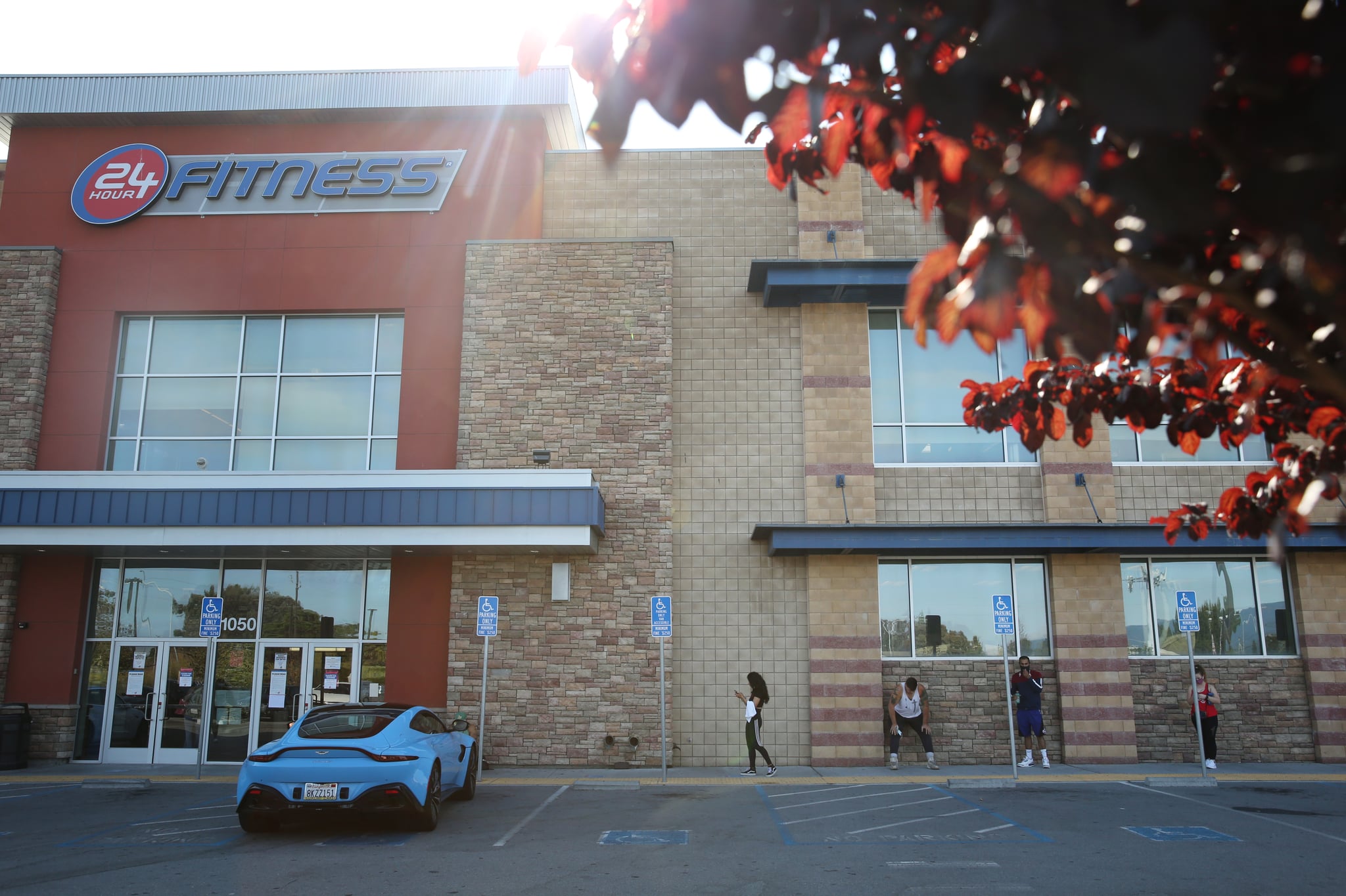 People outside the 24 Hour Fitness/Redwood City Super Sport in Redwood City, Calif