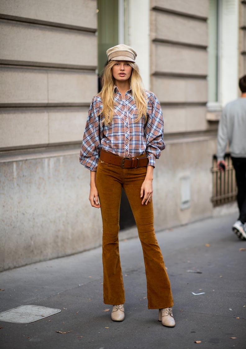 Romee Strijd Was Seen Wearing a Flat Cap With a Plaid Top and Brown Trousers During PFW