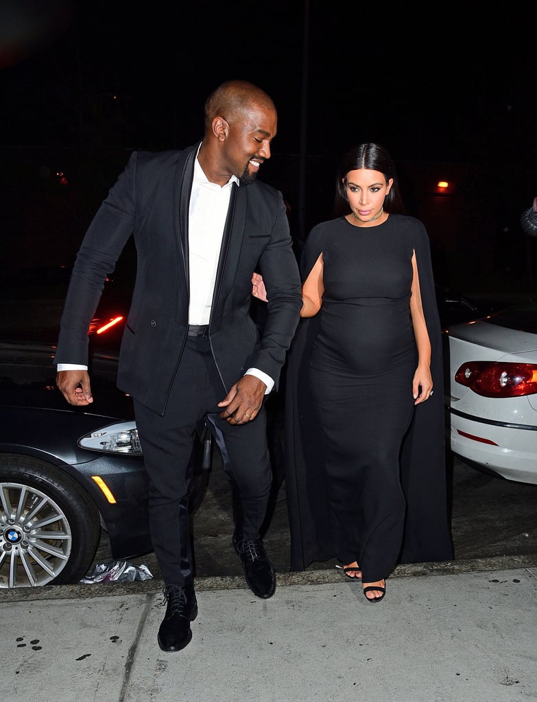 Kanye's Haider Ackermann outfit complemented Kim's, as the pair strutted into the wedding arm in arm.