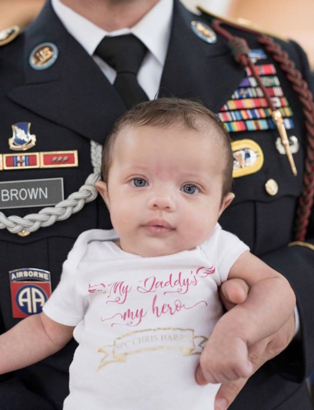 Daughter Of Fallen Soldier Photographed With Army Members