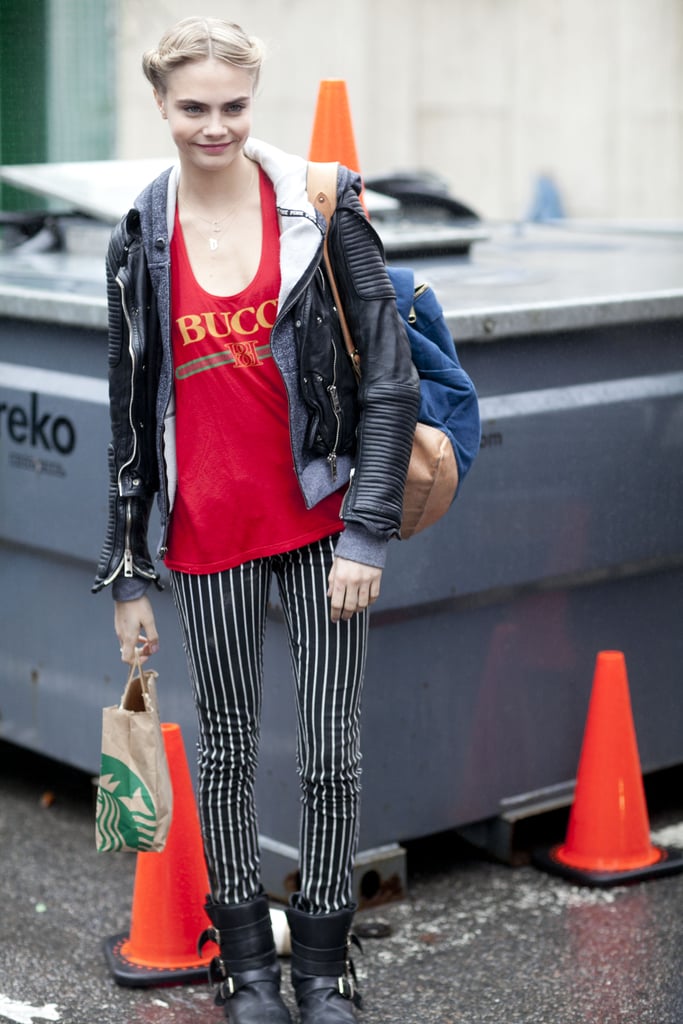 Cara Delevingne worked the '90s grunge angle in a pair of striped pants and biker boots.
Cara Delevingne worked the '90s grunge angle in a pair of striped pants and biker boots.