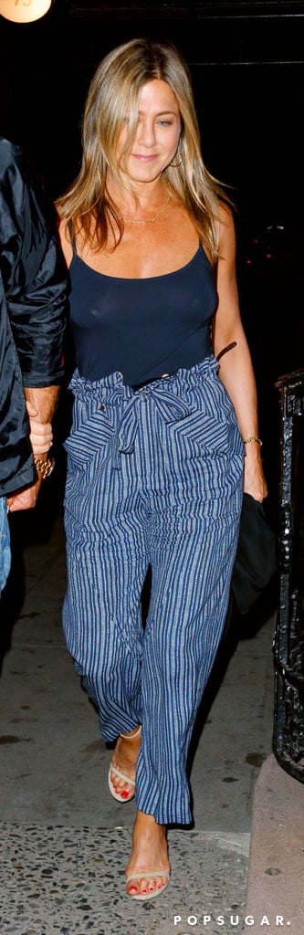 Jennifer Aniston Wearing Striped Trousers Popsugar Fashion