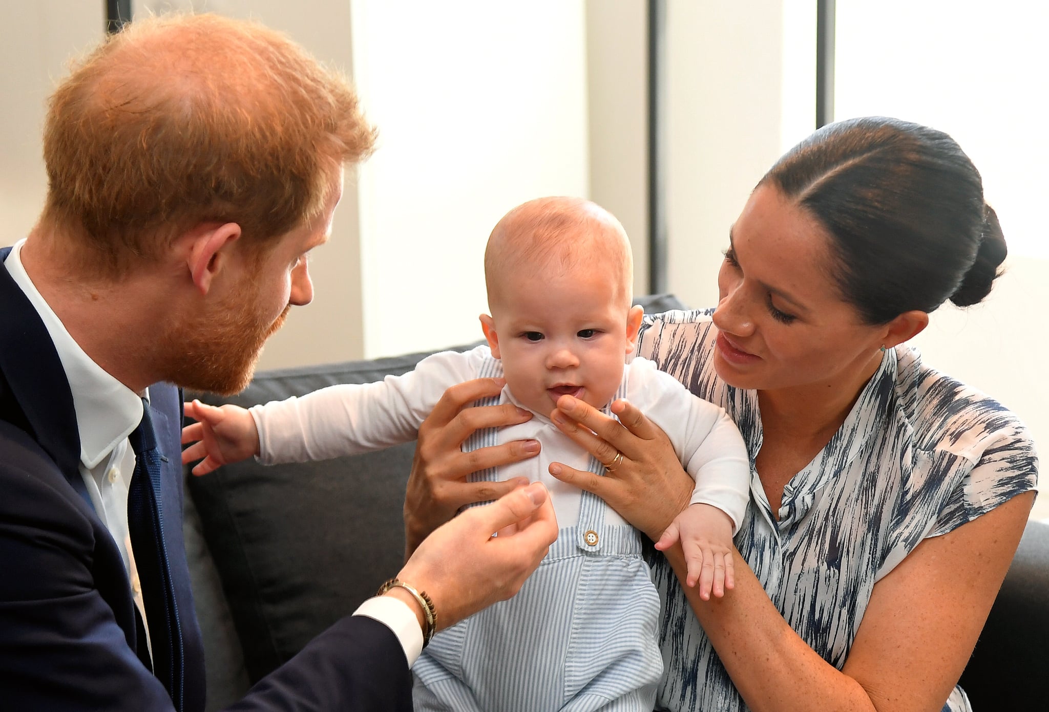 CAPE TOWN, SOUTH AFRICA - SEPTEMBER 25: Prince Harry, Duke of Sussex and Meghan, Duchess of Sussex tend to their baby son Archie Mountbatten-Windsor at a meeting with Archbishop Desmond Tutu at the Desmond & Leah Tutu Legacy Foundation during their royal tour of South Africa on September 25, 2019 in Cape Town, South Africa. (Photo by Toby Melville - Pool/Getty Images)