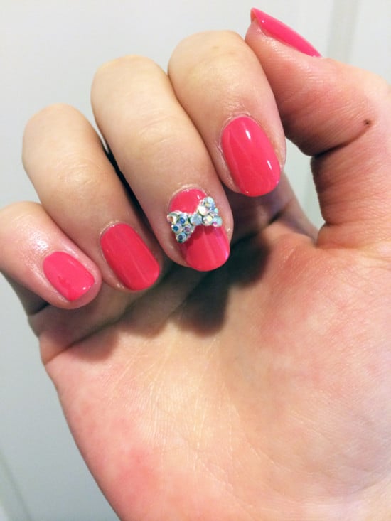 Wrap up your nail art with a big glittery bow for the holidays.