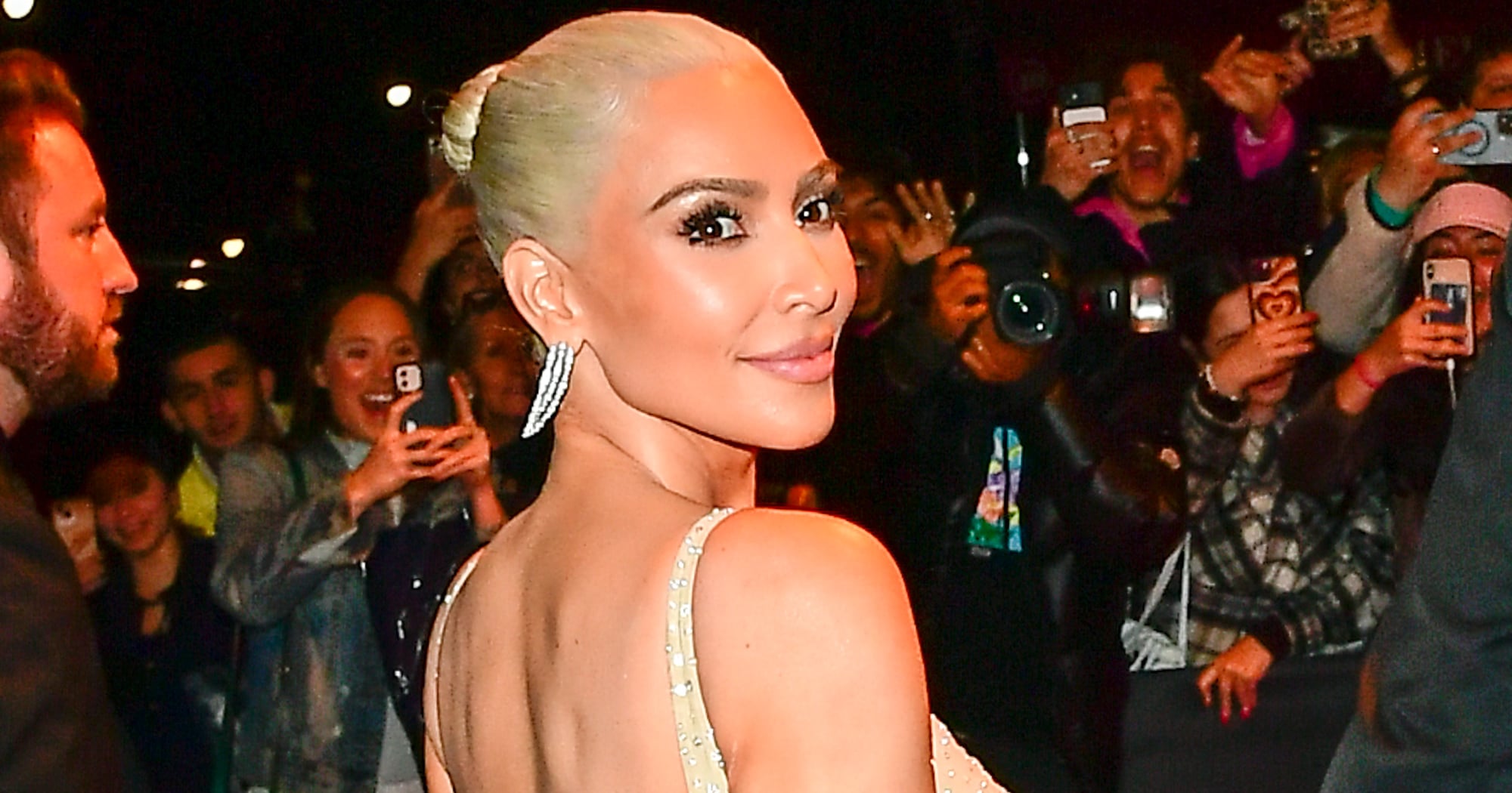 Kim Kardashian channels Carmen Electra in backless cutout dress