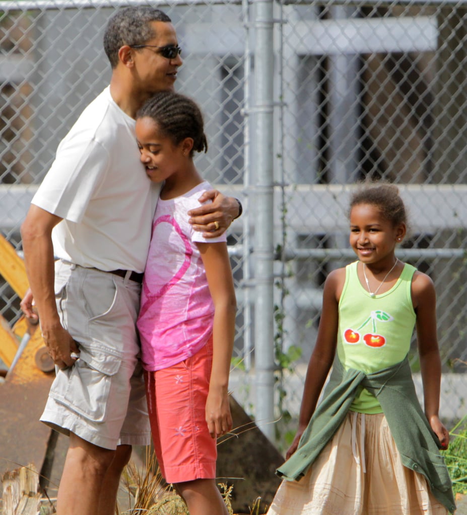 Barack embraced his eldest daughter before entering the Honolulu Zoo in December 2008.