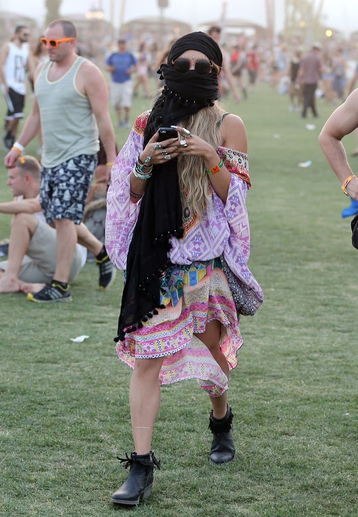 Vanessa Hudgens braved a sandstorm with a black scarf.