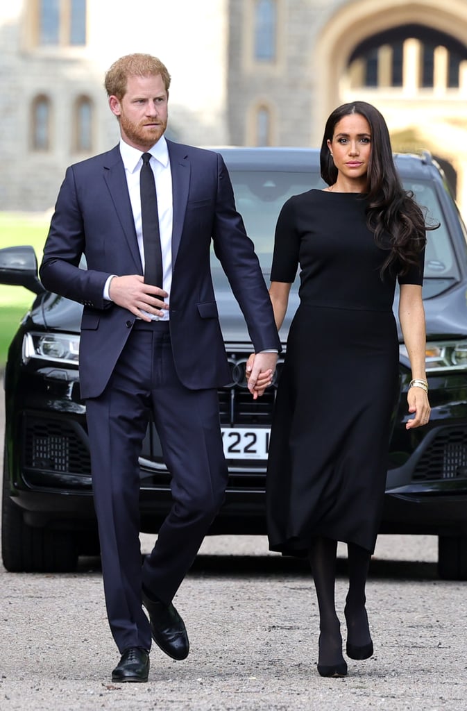 On Sept. 10, Prince Harry and Meghan Markle dressed in dark colors of mourning for the walk at Windsor Castle, where they viewed flowers and tributes to Queen Elizabeth II. While Harry opted for a navy suit and black tie to accent his oxfords, Markle wore a three-quarter-sleeved knit midi dress over sheer tights with Sarah Flint suede pumps; Cartier jewelry, including her famous Tank watch; Ecksand butterfly earrings; and her wedding-ring stack.