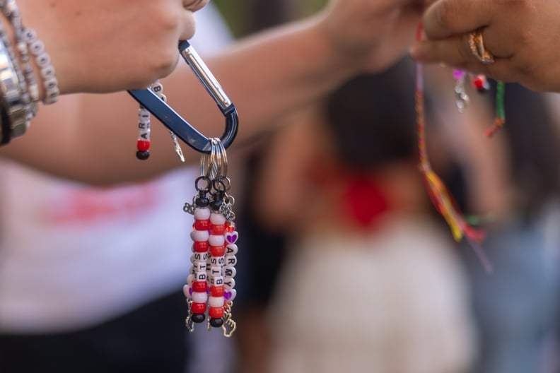 K-pop fans exchanging friendship keychains